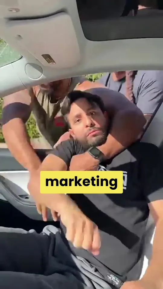 A man in the back seat of a car, captioned marketing