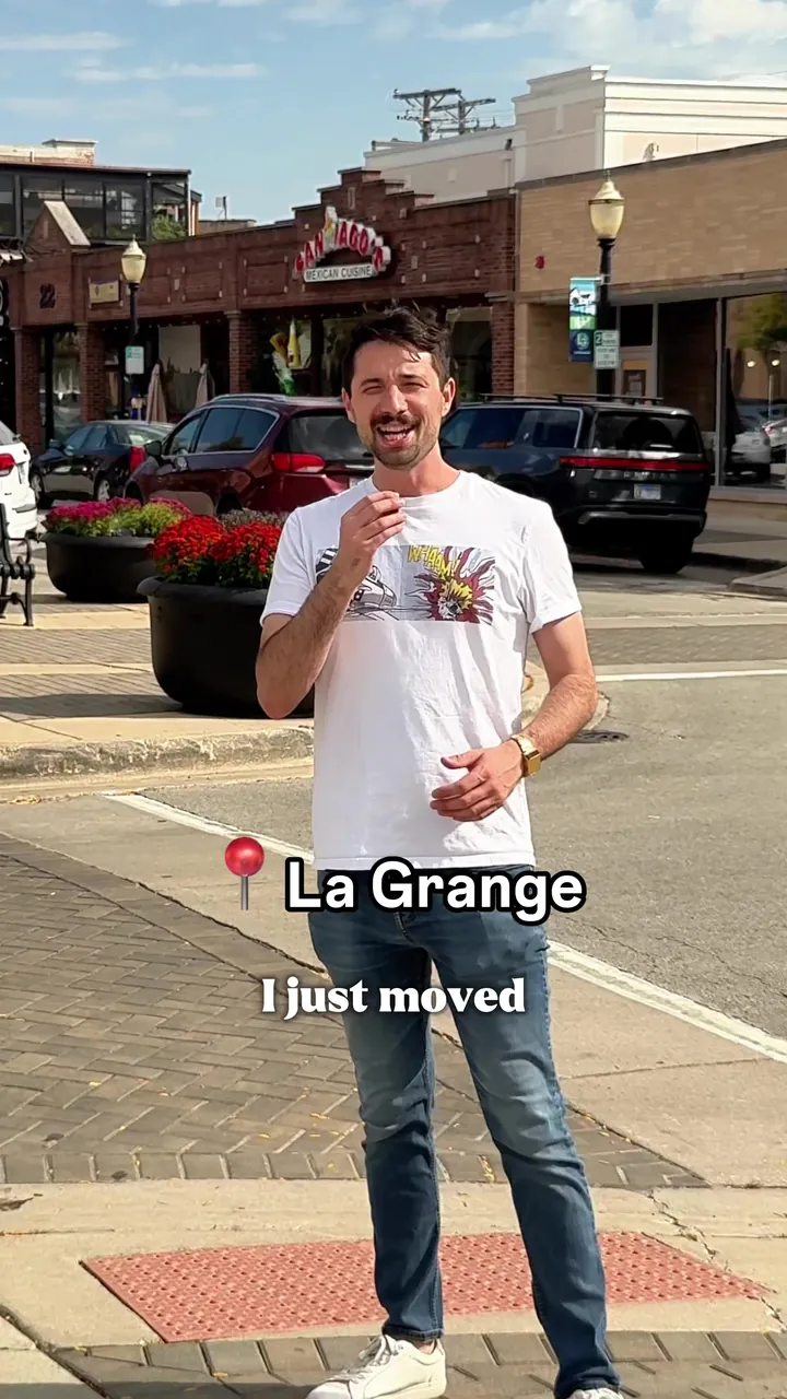 Morgan on a La Grange street corner, captioned I just moved